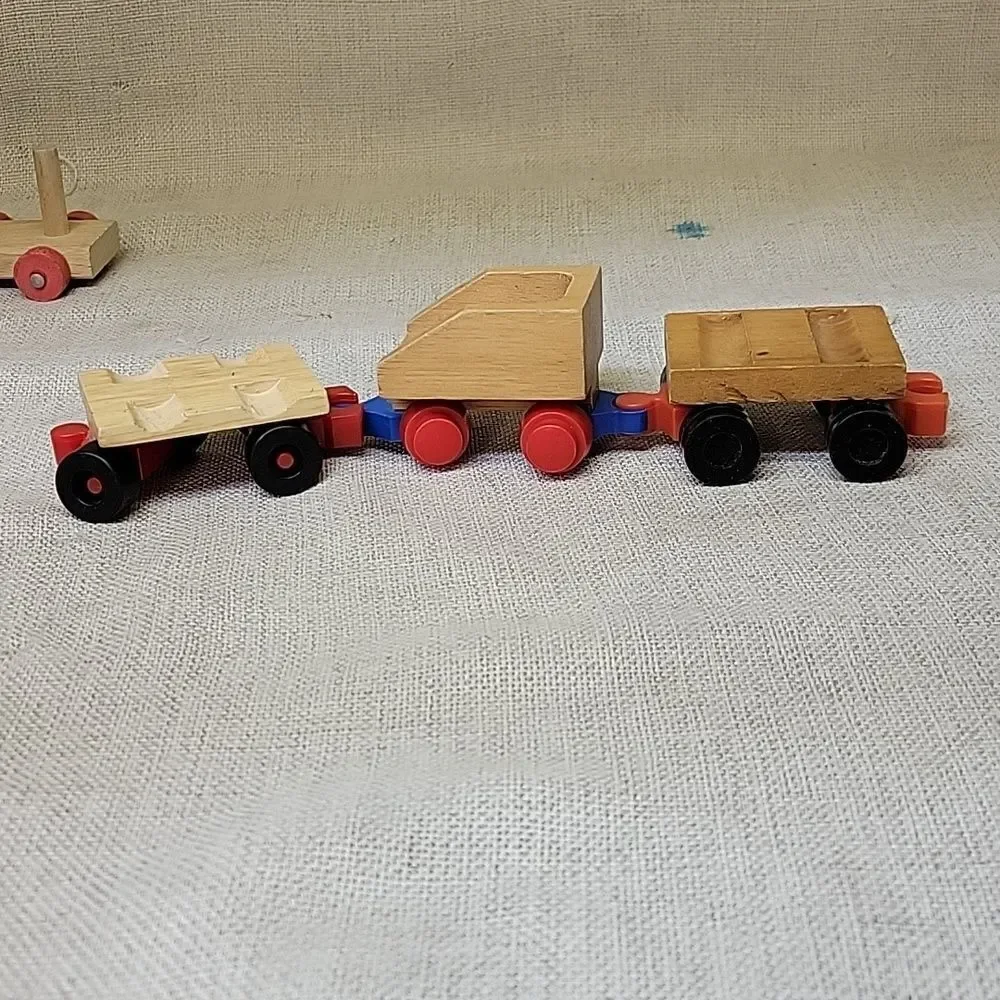 Assorted small wood‎ vehicles..train, dumo truck, race cars...